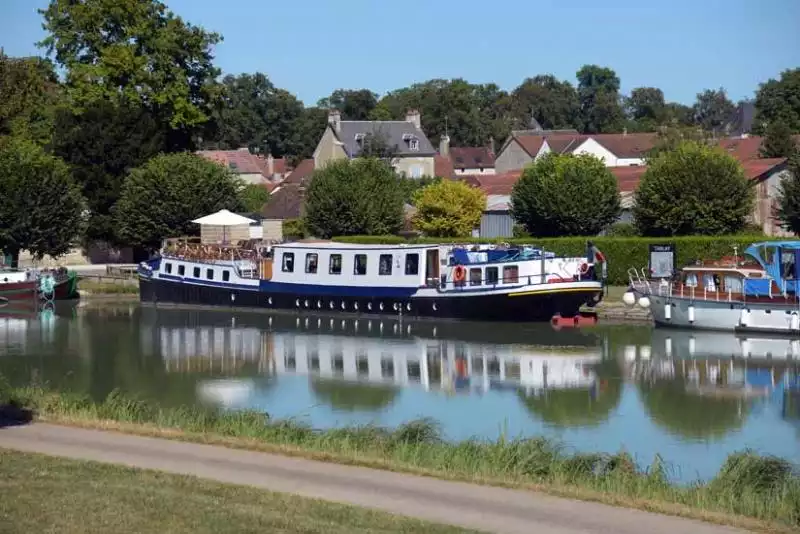 La Belle Epoque moored in a village