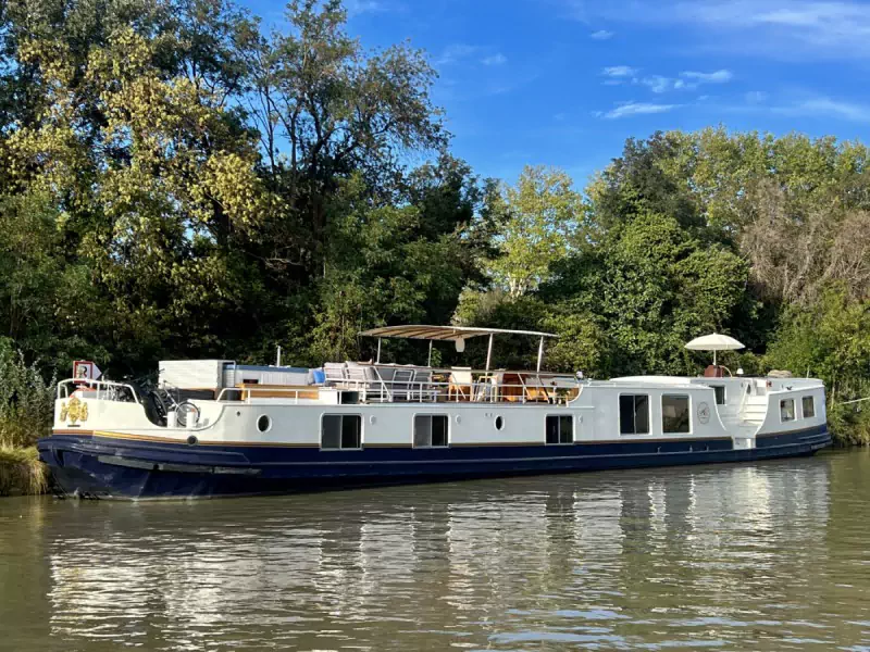 Hotel barge Elegace moored on the Canal du Midi