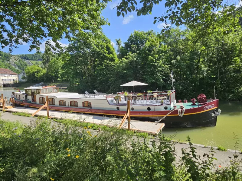 Barge Mirage moored along the canal